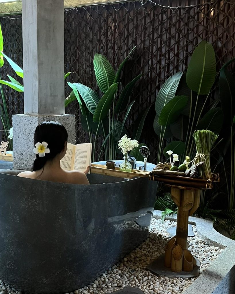 A guest relaxing in a tranquil treatment room at Nguon Spa