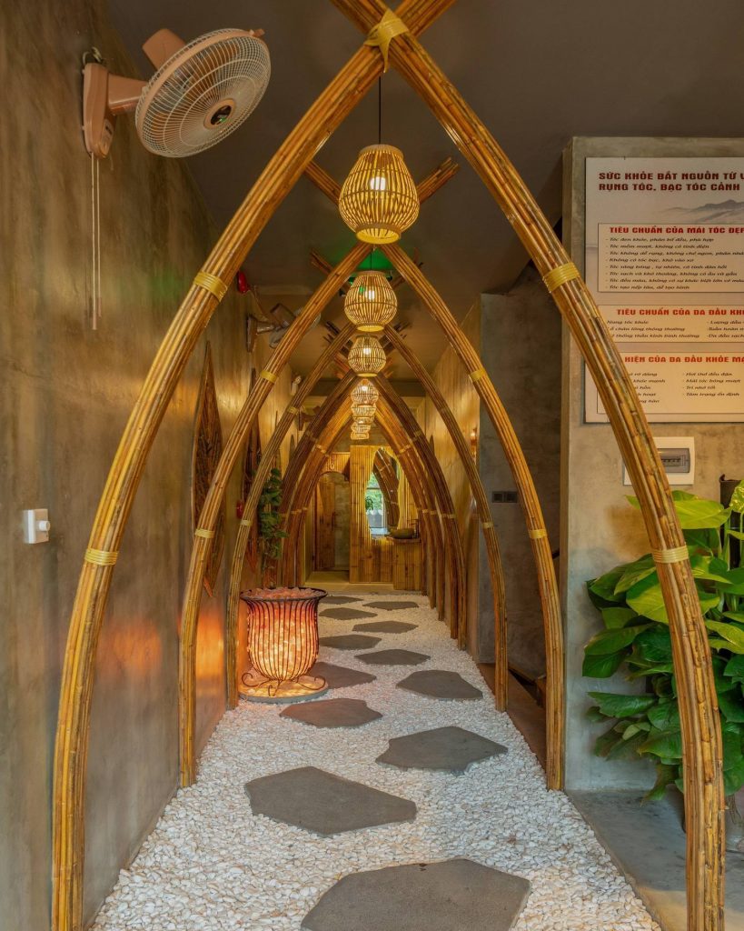 The serene atmosphere of Nguồn Spa, where the soothing bamboo decor and gentle lighting create the perfect environment for relaxation.