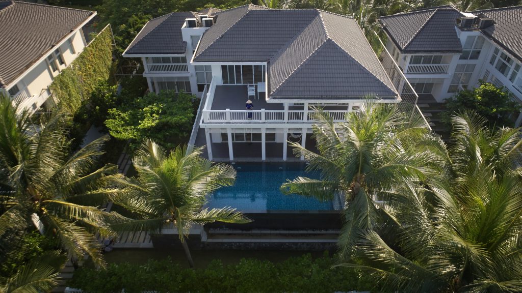 A stunning view of a Beach Front Villa at Premier Village, featuring modern architecture, private terrace, and panoramic views of the ocean.