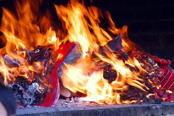 Burning paper money during the Ghost Festival (Lễ Xá Tội Vong Nhân) in the lunar month of July in Vietnam.