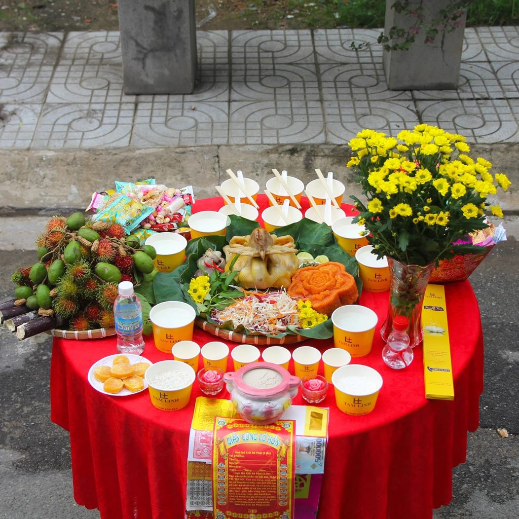 A traditional offering tray for the Ghost Festival (Lễ Xá Tội Vong Nhân) in the lunar month of July in Vietnam. The tray is adorned with various foods such as fruits, rice, and incense, prepared to honor wandering spirits