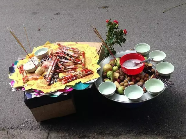 A traditional offering tray for the Ghost Festival (Lễ Xá Tội Vong Nhân) in the lunar month of July in Vietnam. The tray is adorned with various foods such as fruits, rice, and incense, prepared to honor wandering spirits